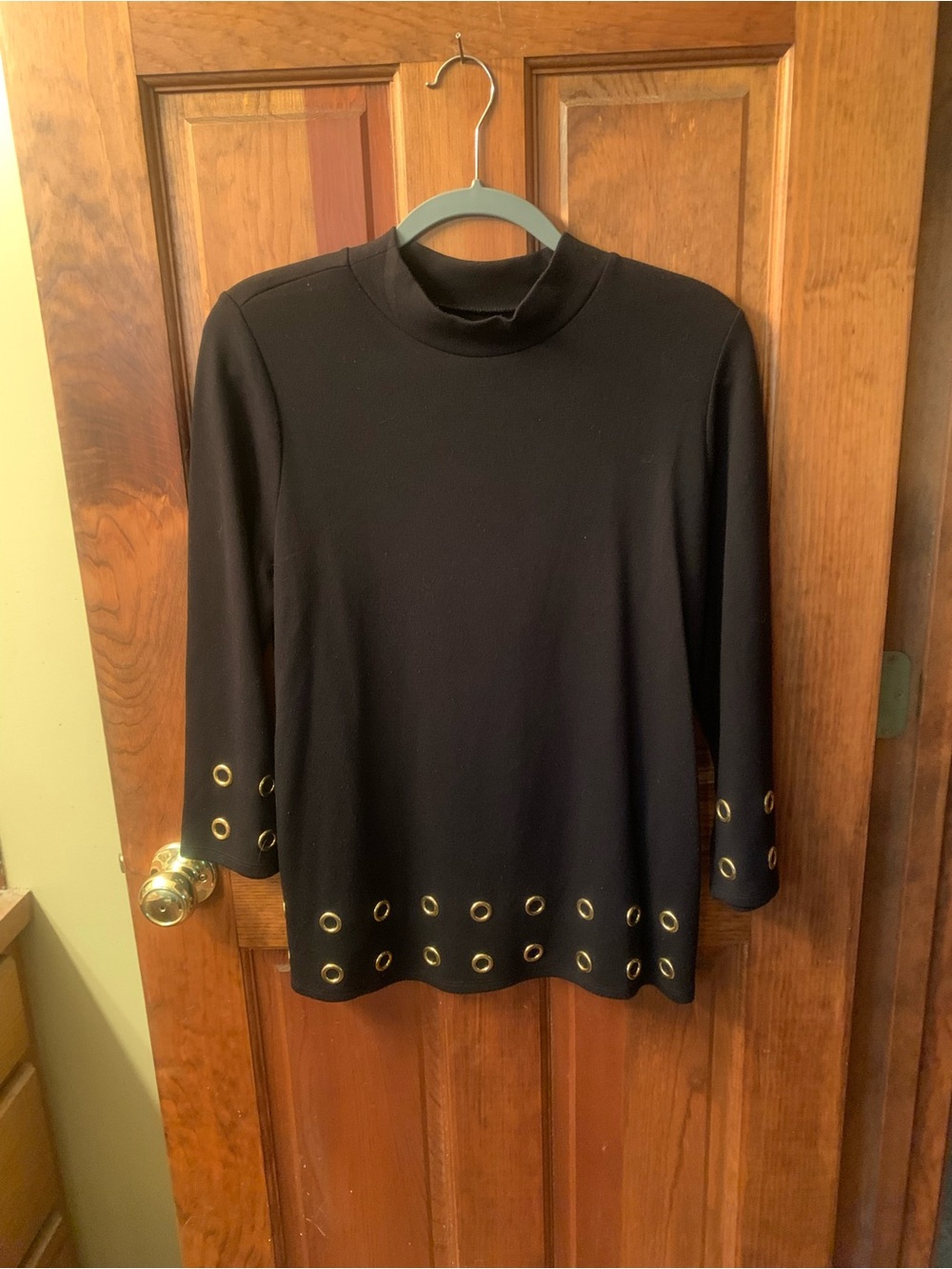 Chico's NEW NEVER WORN, BLACK mock neck top with GOLD grommet’s on sleeves/ hem.